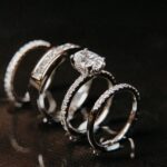 Three,Elegant,White,Gold,And,Diamond,Rings,Displayed,On,A